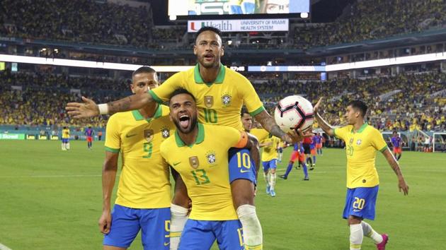 Miami Gardens: Brazil forward Neymar (10) celebrates with Dani Alves (13) and Richarlison (9) after scoring the second goal of his team during the second half of an international friendly soccer match against Colombia, Friday, Sept. 6, 2019, in Miami Gardens(AP) Miami Gardens: Brazil forward Neymar (10) celebrates with Dani Alves (13) and Richarlison (9) after scoring the second goal of his team during the second half of an international friendly soccer match against Colombia, Friday, Sept. 6, 2019, in Miami Gardens(AP)