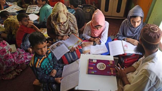 Children study at the residence of a tuition teacher in the outskirts of Srinagar, Jammu and Kashmir. (Waseem Andrabi / HT Photo) Children study at the residence of a tuition teacher in the outskirts of Srinagar, Jammu and Kashmir. (Waseem Andrabi / HT Photo)