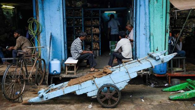 Labourers wait for customers outside hardware workshops in Mumbai, Maharashtra. (Noemi Cassanelli / AFP) Labourers wait for customers outside hardware workshops in Mumbai, Maharashtra. (Noemi Cassanelli / AFP)