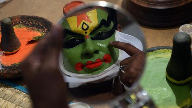 A Kathakali artist prepares backstage for a performance at a cultural festival at Kalakshetra Art Village in Chennai, Tamil Nadu. (Arun Sankar / AFP) A Kathakali artist prepares backstage for a performance at a cultural festival at Kalakshetra Art Village in Chennai, Tamil Nadu. (Arun Sankar / AFP)