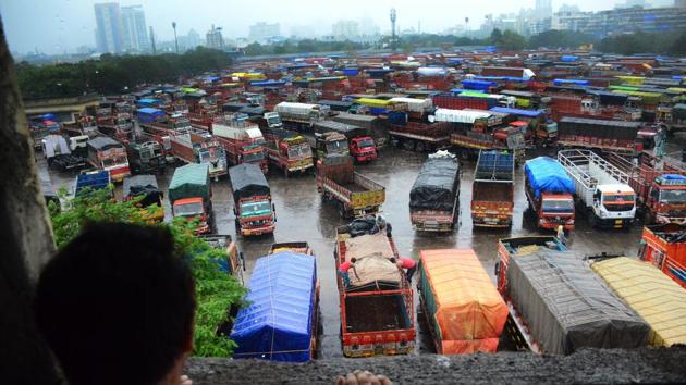 A boy looks at parked trucks at a terminal at Vashi, in Navi Mumbai, Maharashtra. (Bachchan Kumar / HT Photo) A boy looks at parked trucks at a terminal at Vashi, in Navi Mumbai, Maharashtra. (Bachchan Kumar / HT Photo)