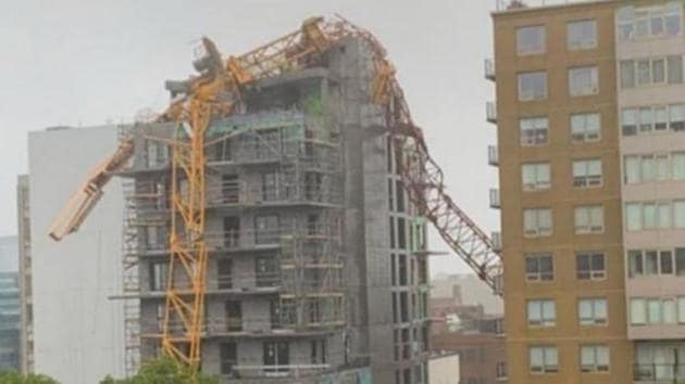 The crane collapsed onto an under construction building.(Twitter/@FinlayM)