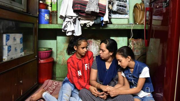 Lovely with her sister Tehjib Khan, 8, and their mother Reshma Khatun (C) at their one room house at Hide Road Colony. Khatun, is a tailor and their father Taj Khan, a driver. For this family of modest means, this has been an absolute shocker. “I could never imagine that such people of importance will praise my daughter,” she said, her eyes welling up with tears. (Samir Jana / HT Photo) Lovely with her sister Tehjib Khan, 8, and their mother Reshma Khatun (C) at their one room house at Hide Road Colony. Khatun, is a tailor and their father Taj Khan, a driver. For this family of modest means, this has been an absolute shocker. “I could never imagine that such people of importance will praise my daughter,” she said, her eyes welling up with tears. (Samir Jana / HT Photo)