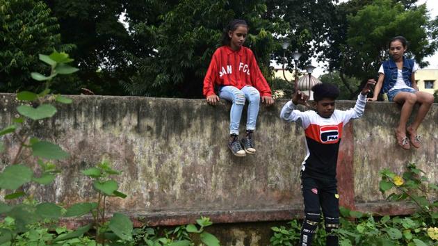 Muhammad Azajuddin aka Ali (C) jumps from a fence while Lovely and her younger sister Tehjib look on as they enter the practice ground. For their teacher Shekhar Rao, this has been a moment making a dream come true . He’s been teaching children residing in the city’s slums for the last four years free of cost and it hasn’t been easy task, he said. (Samir Jana / HT Photo) Muhammad Azajuddin aka Ali (C) jumps from a fence while Lovely and her younger sister Tehjib look on as they enter the practice ground. For their teacher Shekhar Rao, this has been a moment making a dream come true . He’s been teaching children residing in the city’s slums for the last four years free of cost and it hasn’t been easy task, he said. (Samir Jana / HT Photo)