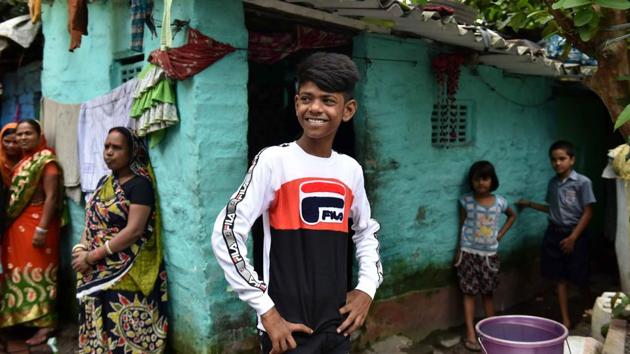 Ali poss for the camera in front of his family residence at Coal Berth Colony, Garden Reach. While Lovely finds dance more to her liking, Ali, however, now dreams of making his country proud in the field of gymnastics. “I want to pursue gymnastics and bring medals for my country,” he said. (Samir Jana / HT Photo) Ali poss for the camera in front of his family residence at Coal Berth Colony, Garden Reach. While Lovely finds dance more to her liking, Ali, however, now dreams of making his country proud in the field of gymnastics. “I want to pursue gymnastics and bring medals for my country,” he said. (Samir Jana / HT Photo)