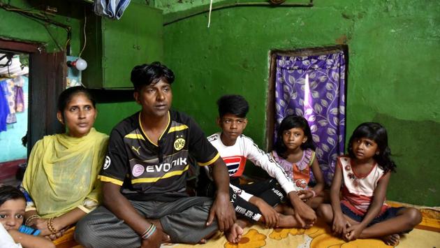 Ali (3rd L) with his parents and siblings in their one room home. Ali's parents are labourers and the family of six rests on their meagre incomes from work at a tea godown. (Samir Jana / HT Photo) Ali (3rd L) with his parents and siblings in their one room home. Ali's parents are labourers and the family of six rests on their meagre incomes from work at a tea godown. (Samir Jana / HT Photo)