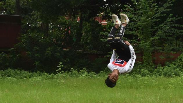 Ali just about to land a somersault at their grassy training ground beside Eternities Dance Academy. Shekhar echoes the fact that it is difficult to draw students from economically weaker segments into nice sports and athletic avenues --a conversation he’s had with many parents over the years. But seeing Lovely and Ali’s skills being appreciated, he feel’s the effort has all been worth it. (Samir Jana / HT Photo) Ali just about to land a somersault at their grassy training ground beside Eternities Dance Academy. Shekhar echoes the fact that it is difficult to draw students from economically weaker segments into nice sports and athletic avenues --a conversation he’s had with many parents over the years. But seeing Lovely and Ali’s skills being appreciated, he feel’s the effort has all been worth it. (Samir Jana / HT Photo)