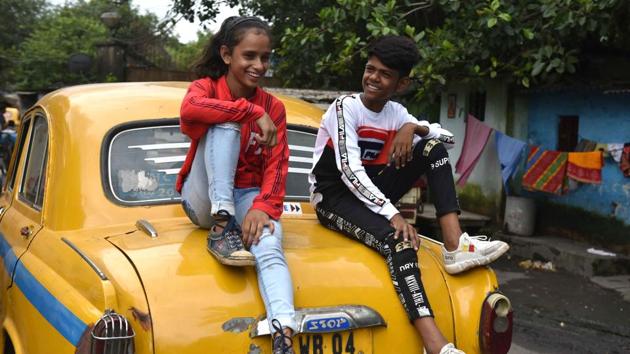 Jashika Khan aka Lovely and Muhammad Azajuddin aka Ali on a taxi in front of Ali’s residence at Coal Berth colony, Garden Reach in Kolkata. Till a few days ago, the two were like any of the other kids in their locality. That’s changed, and fast. Ask about, and residents are quick to point to their homes –all from tweet by a five-time Olympic gold medallist gymnast Nadia Comaneci. (Samir Jana / HT Photo) Jashika Khan aka Lovely and Muhammad Azajuddin aka Ali on a taxi in front of Ali’s residence at Coal Berth colony, Garden Reach in Kolkata. Till a few days ago, the two were like any of the other kids in their locality. That’s changed, and fast. Ask about, and residents are quick to point to their homes –all from tweet by a five-time Olympic gold medallist gymnast Nadia Comaneci. (Samir Jana / HT Photo)