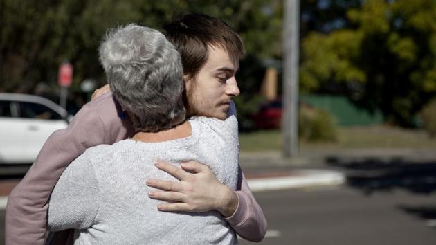 On July 19, three weeks later, he stepped off the bus. His sweatshirt and sweatpants hung loosely on his skeletal frame. It was clear he hadn’t showered. Deb wrapped him in a hug and rustled his messy hair. He tried to explain why he withdrew his consent. He was worried she’d say something to the doctors that would get him committed to the mental health ward. He regrets it now. (David Goldman / AP) On July 19, three weeks later, he stepped off the bus. His sweatshirt and sweatpants hung loosely on his skeletal frame. It was clear he hadn’t showered. Deb wrapped him in a hug and rustled his messy hair. He tried to explain why he withdrew his consent. He was worried she’d say something to the doctors that would get him committed to the mental health ward. He regrets it now. (David Goldman / AP)