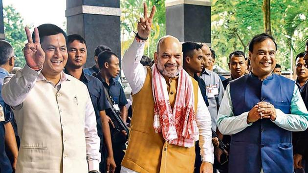 Assam CM Sarbananda Sonowal, Union minister Amit Shah and state minister Himanta Biswa Sarma in Guwahati on Sunday. (HT image) Assam CM Sarbananda Sonowal, Union minister Amit Shah and state minister Himanta Biswa Sarma in Guwahati on Sunday. (HT image)