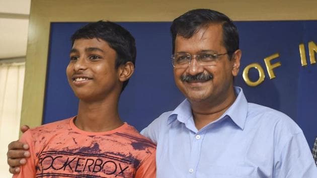 New Delhi: Delhi Chief Minister Arvind Kejriwal and Vijay Kumar, son of a tailor and a homemaker who cracked the IIT entrance examination, pose for a photograph during a press conference, in New Delhi, Sunday, Sep 08, 2019. (PTI Photo/Atul Yadav)(PTI9_8_2019_000043B)(PTI)