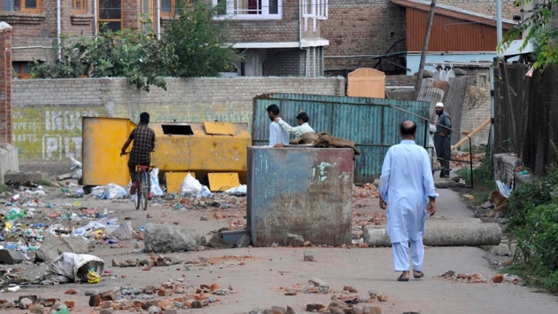 “India says it wanted to integrate Kashmir but it is an ugly country. You are a sham democracy,’’ says a young man on a street in a South Kashmir village.(Waseem Andrabi/HT Photo)