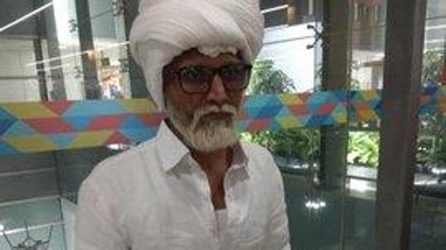 Jayesh Patel, a resident of Ahmedabad, coloured his hair and beard white, arrived on a wheelchair to board a flight to New York from the Indira Gandhi International Airport on Sunday, they said.(Photo: Twitter/@CISFHQrs)