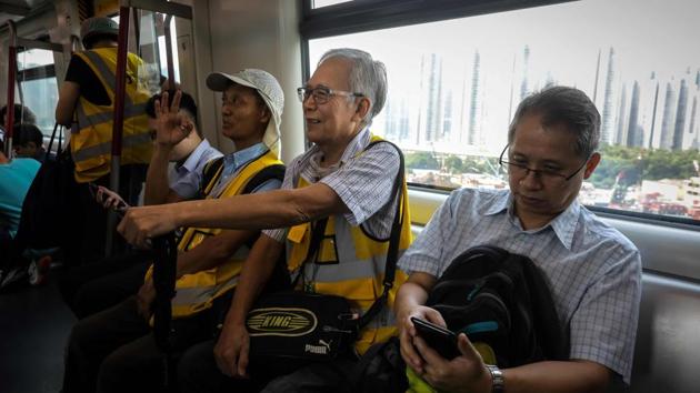 Grandpa Wong rides an MTR train to the Tung Chung district in Hong Kong. The movement however maintains widespread support across the public with lawyers, doctors, nurses, teachers and civil servants all holding recent solidarity rallies, even as the violence escalates. Groups of elderly people -- dubbed “silver hairs” -- have also marched. (Vivek Prakash / AFP) Grandpa Wong rides an MTR train to the Tung Chung district in Hong Kong. The movement however maintains widespread support across the public with lawyers, doctors, nurses, teachers and civil servants all holding recent solidarity rallies, even as the violence escalates. Groups of elderly people -- dubbed “silver hairs” -- have also marched. (Vivek Prakash / AFP)