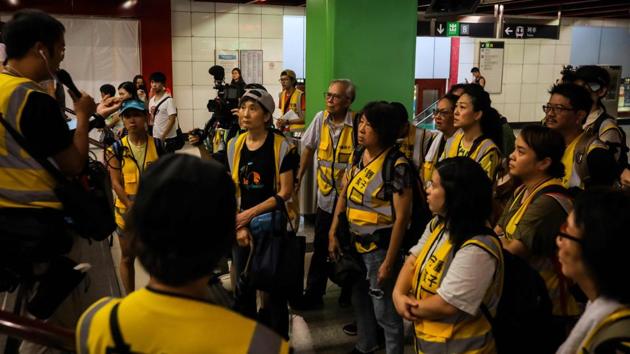 Grandpa Wong (behind C), listens to a pre-protest briefing along with other volunteers in the Lai King district. Wong and his friend “Grandpa Chan”, a comparatively spry 73-year-old, are among the most pro-active of this older generation. The two are part of a group called “Protect the Children”, made up of mostly senior citizens and volunteers. (Vivek Prakash / AFP) Grandpa Wong (behind C), listens to a pre-protest briefing along with other volunteers in the Lai King district. Wong and his friend “Grandpa Chan”, a comparatively spry 73-year-old, are among the most pro-active of this older generation. The two are part of a group called “Protect the Children”, made up of mostly senior citizens and volunteers. (Vivek Prakash / AFP)