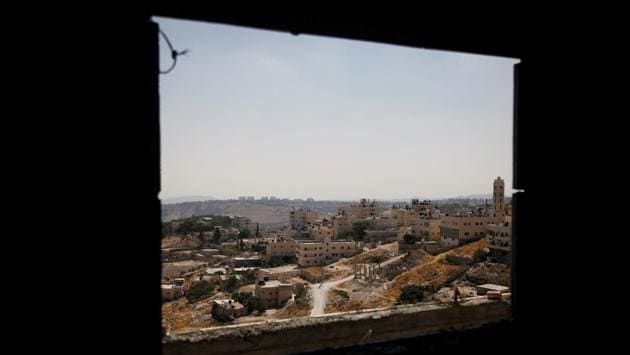 A view shows Palestinian houses in al-Eizariya village, close to the Jewish settlement of Maale Adumim, in the Israeli-occupied West Bank. Israel’s settlements in the occupied West Bank are one of the most heated issues in the Israeli-Palestinian conflict. The Palestinians want the area, captured by Israel in a 1967 war, for a future state. (Raneen Sawafta / REUTERS) A view shows Palestinian houses in al-Eizariya village, close to the Jewish settlement of Maale Adumim, in the Israeli-occupied West Bank. Israel’s settlements in the occupied West Bank are one of the most heated issues in the Israeli-Palestinian conflict. The Palestinians want the area, captured by Israel in a 1967 war, for a future state. (Raneen Sawafta / REUTERS)