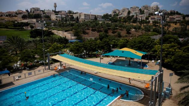 A view of a public pool in the settlement of Maale Adumim. Against the backdrop of desert hills, the villas of Maale Adumim provide their inhabitants with a comfortable life. Education is good and transport to the city is easy. (Ronen Zvulun / REUTERS) A view of a public pool in the settlement of Maale Adumim. Against the backdrop of desert hills, the villas of Maale Adumim provide their inhabitants with a comfortable life. Education is good and transport to the city is easy. (Ronen Zvulun / REUTERS)