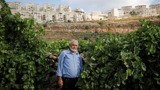 For Mohammad Awad, a 64-year-old farmer from Wadi Fukin, a Palestinian village next to Beitar Illit, it makes no difference why people come to live in the settlement. "It's impossible to have peace between us because the main conflict between us is on a piece of land which they took by force, so how can I let a person steal my land, live in it and enjoy it, and live with him in peace?" he said. (Raneen Sawafta / REUTERS) For Mohammad Awad, a 64-year-old farmer from Wadi Fukin, a Palestinian village next to Beitar Illit, it makes no difference why people come to live in the settlement. "It's impossible to have peace between us because the main conflict between us is on a piece of land which they took by force, so how can I let a person steal my land, live in it and enjoy it, and live with him in peace?" he said. (Raneen Sawafta / REUTERS)