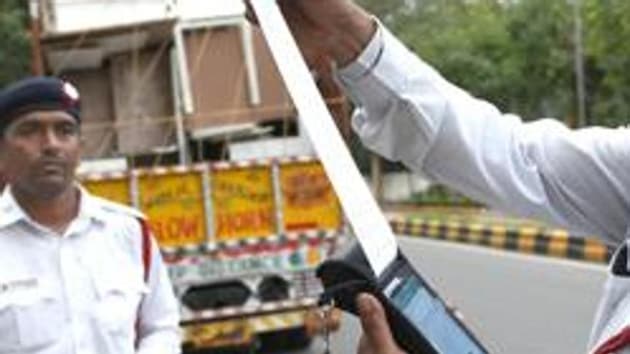 Bikaner’s Harman Ram Bhambhu, owner of a truck (No. RJ07GD0237), was fined for overloading and violation of registration certificate and permit rules.(HT image)