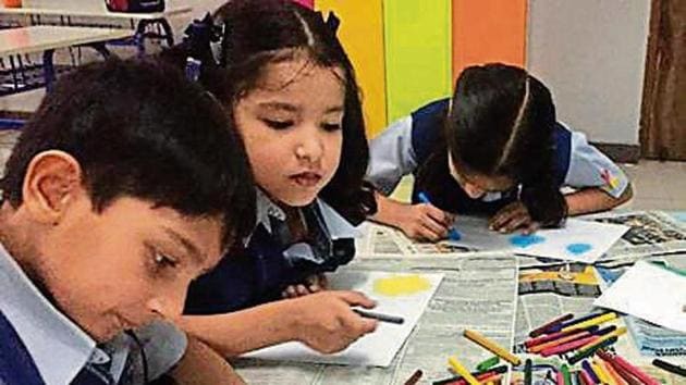 Students colouring their sketches.(HT) Students colouring their sketches.(HT)