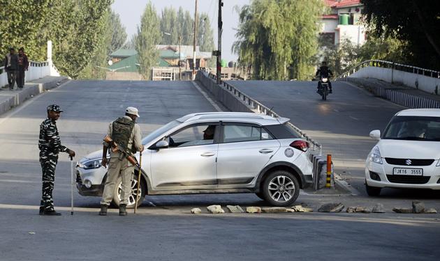 CRPF personnel stop vechiles during restrictions in Srinagar on Tuesday. (ANI Photo) CRPF personnel stop vechiles during restrictions in Srinagar on Tuesday. (ANI Photo)