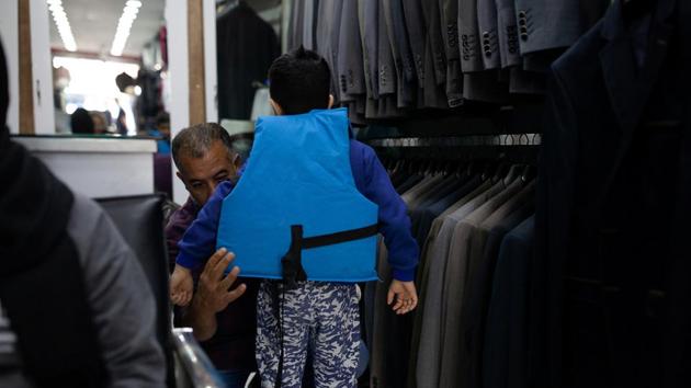 The family bought life jackets - a simple but risky transaction which carries the possibility of arrest. At 11 p.m., the smuggler still had not called. They feared they had lost their money again but he eventually did a few days later. The people on the small boat were loud, so the Turkish coast guard found them, 20 minutes away from the border. They were held in jail for three days. (Ekaterina Anchevskaya / REUTERS) 