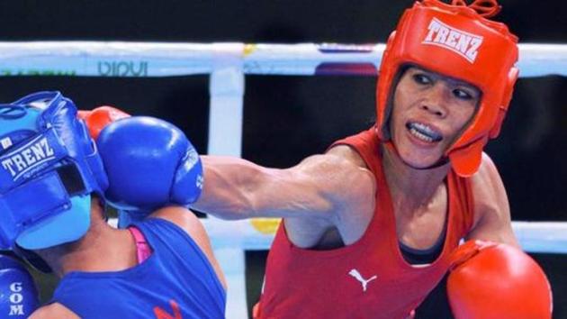 Mary Kom (R) punches Nepal's Mala Rai after their bout.(PTI)