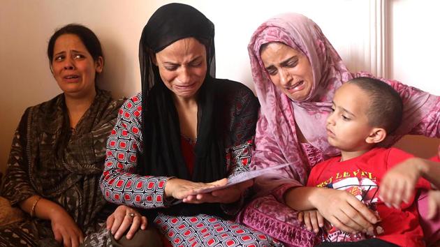 “A CRPF vehicle stopped near the edge of the park and fired a tear gas shell straight at his head,” Shaheena (2nd L), Khan’s mother said as she cried in her home. “I saw him fall and then they (soldiers) fired pellets on him. “Khan’s hospital records, seen by AFP, showed he suffered “severe traumatic brain injury” and cited “pellet injury with shell blast injury” as the cause of death. (Parvaiz Bukhari / AFP) 