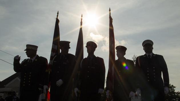 Americans are commemorating 9/11 with mournful ceremonies, volunteering (AP Photo)