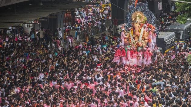 Devotees in the thousands were out on the roads of Mumbai, ferrying Ganesha idols, big and small at various points in the city after the end of the 10-day celebrations. More than 50,000 police personnel have been deployed across the metropolis to ensure that Ganesh idol immersion processions pass off without any untoward incident. (Satyabrata Tripathy / Ht Photo) 