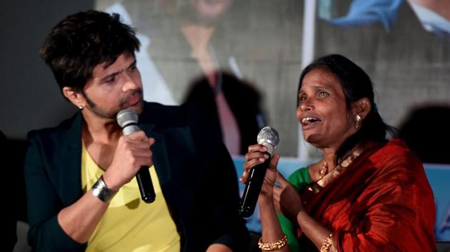 Himesh Reshammiya (L) and Ranu Mondal take part in a promotional event for Himesh's upcoming romantic Hindi comedy film Happy Hardy and Heer.(AFP) Himesh Reshammiya (L) and Ranu Mondal take part in a promotional event for Himesh's upcoming romantic Hindi comedy film Happy Hardy and Heer.(AFP)