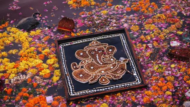And immersions needn’t necessarily be those of idols. With moves towards eco-friendly paints and manufacturing processes for the idols themselves, this interpretation of the deity in Rajasthan’s Ajmer, in the form of an embellished canvas piece made with fabrics is a hint that cleanliness doesn’t always have follow godliness. (Himanshu Sharma / AFP) 