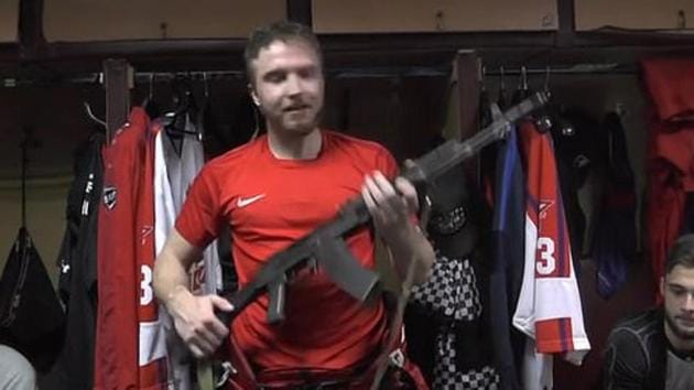 Saveli Kononov poses with AK-47 assault rifle.(Twitter Video Screenshot)