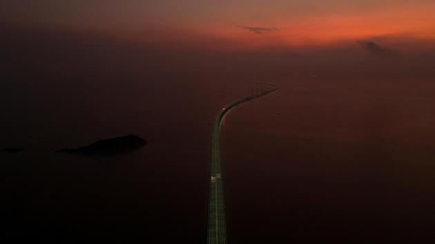 An aerial view shows the Hong Kong-Zhuhai-Macau bridge, a key infrastructure in the Greater Bay Area project, during sunrise off Zhuhai, Guangdong province, China. (REUTERS) An aerial view shows the Hong Kong-Zhuhai-Macau bridge, a key infrastructure in the Greater Bay Area project, during sunrise off Zhuhai, Guangdong province, China. (REUTERS)