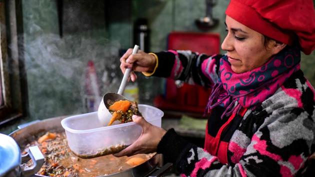 A woman serves food at the soup kitchen. Argentina-- South America’s second-largest economy and a land of contradictions with a widening gap between rich and poor -- is also one of the continent’s three countries where hunger has increased in 2018, alongside Venezuela and Guatemala. An average basket of household goods costs 4,200 pesos – 57% higher than in July last year, and well above wage increases. (Ronaldo Schemidt / AFP)