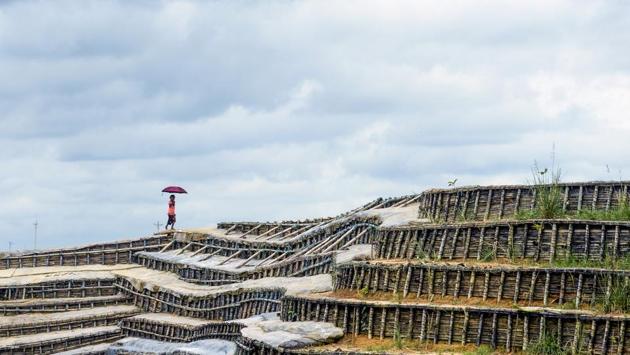A Rohingya child walks on the slope of a hill at the Kutupalong refugee camp in Ukhia, Bangladesh. (Munir uz Zaman / AFP) A Rohingya child walks on the slope of a hill at the Kutupalong refugee camp in Ukhia, Bangladesh. (Munir uz Zaman / AFP)
