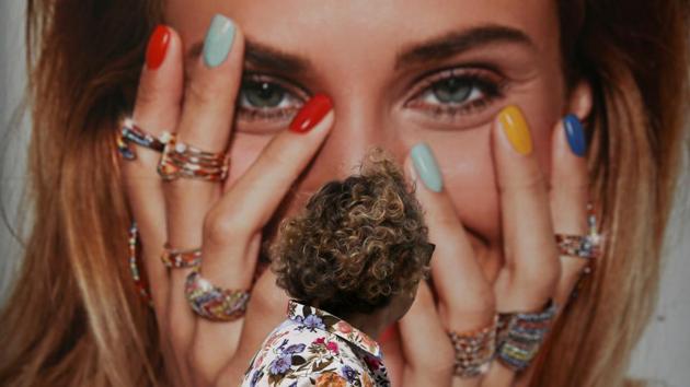 A woman looks at a jewellery ad at a shopping district in central Madrid, Spain. (Susana Vera / REUTERS) A woman looks at a jewellery ad at a shopping district in central Madrid, Spain. (Susana Vera / REUTERS)