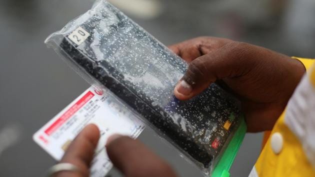 A traffic police officer uses a device to fine a driver for breaking traffic rules in Mumbai, September 5, 2019. There has been a public outcry over the hefty fines for traffic violations under the amended Motor Vehicles Act. (REUTERS) A traffic police officer uses a device to fine a driver for breaking traffic rules in Mumbai, September 5, 2019. There has been a public outcry over the hefty fines for traffic violations under the amended Motor Vehicles Act. (REUTERS)