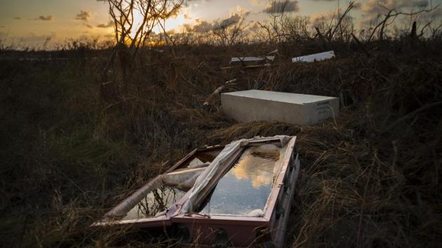 A shattered and water-filled coffin lays exposed to the elements in the aftermath of Hurricane Dorian, at the cemetery in Mclean’s Town, Grand Bahama, Bahamas. Bahamians are tackling a massive clean-up a week after Hurricane Dorian devastated the archipelago’s northern islands. (Ramon Espinosa / AP) A shattered and water-filled coffin lays exposed to the elements in the aftermath of Hurricane Dorian, at the cemetery in Mclean’s Town, Grand Bahama, Bahamas. Bahamians are tackling a massive clean-up a week after Hurricane Dorian devastated the archipelago’s northern islands. (Ramon Espinosa / AP)