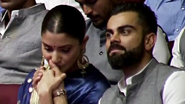 Anushka Sharma kisses her husband Virat Kohli’s hand at a special event in New Delhi.