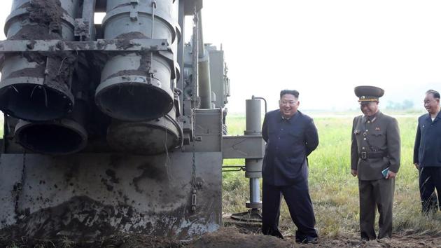 North Korean leader Kim Jong Un attending the testing of a “super-large multiple rocket launcher” at an undisclosed location in North Korea. (KCNA via KNS / AFP) North Korean leader Kim Jong Un attending the testing of a “super-large multiple rocket launcher” at an undisclosed location in North Korea. (KCNA via KNS / AFP)