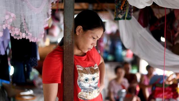 A migrant worker in a guesthouse. Life on a floating guesthouse can be tough. There is no electricity and no running water for the 40 US cents a night rent. Everyone sleeps on thin mats, exposed to the elements inside the open-sided boats, while privacy is non-existent with mosquito nets the only partitions between cramped living quarters. (Manan Vatsyayana / AFP) A migrant worker in a guesthouse. Life on a floating guesthouse can be tough. There is no electricity and no running water for the 40 US cents a night rent. Everyone sleeps on thin mats, exposed to the elements inside the open-sided boats, while privacy is non-existent with mosquito nets the only partitions between cramped living quarters. (Manan Vatsyayana / AFP)