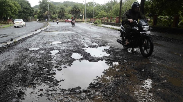 Most potholes re-appeared just before the festive season, when heavy rain lashed the city.(HT image) Most potholes re-appeared just before the festive season, when heavy rain lashed the city.(HT image)
