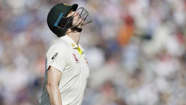 Australia's Steve Smith leaves the pitch after he is caught by England's Ben Stokes.(AP)