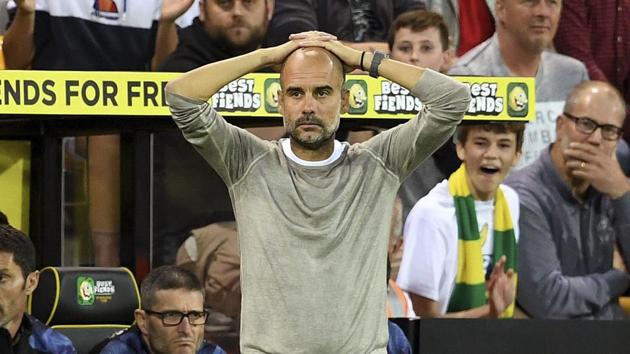 Manchester City manager Pep Guardiola looks dejected.(AP)