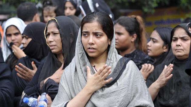 Shiite Muslims take part in a mourning procession marking the day of Ashura, at sector 22, in Noida. Ashura mourns the death of Imam Hussein, a grandson of the Prophet Muhammed, who was killed by armies of the Yazid near Karbala in 680 AD. (Sunil Ghosh / HT Photo)