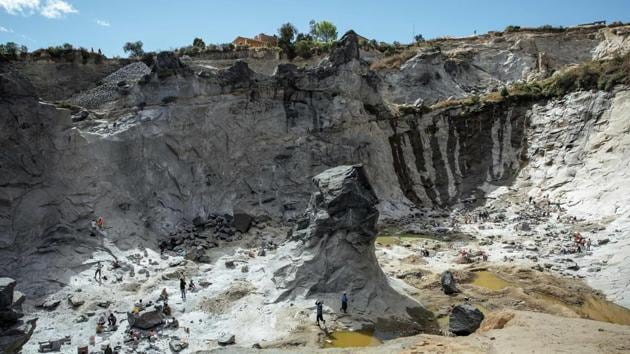Workers from the Father Opeka’s association Akamasoa work in a Granite quarry on July 24, 2019 on the outskirts of Antananarivo. “Father Pedro picked us from the street. He is our Saviour,” said Mampiomina Eloise Rasoanirina, 44, who works at one of Akamasoa’s granite quarries. (Gianluigi Guercia / AFP) Workers from the Father Opeka’s association Akamasoa work in a Granite quarry on July 24, 2019 on the outskirts of Antananarivo. “Father Pedro picked us from the street. He is our Saviour,” said Mampiomina Eloise Rasoanirina, 44, who works at one of Akamasoa’s granite quarries. (Gianluigi Guercia / AFP)
