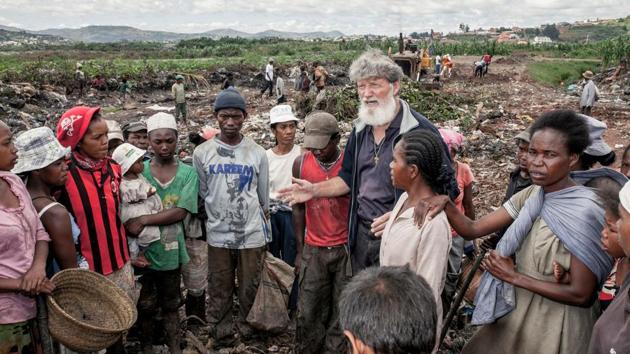 Father Pedro Opeka speaks to people who come every day to the largest landfill in Antananarivo to collect and sort waste that they will then sell on the streets of the Madagascan capital. Today Akamasoa sustains about thirty thousand people in 18 villages, among them ten thousand children, who all go to school, following the building of 37 new schools in the years since Akamasoa’s founding. (Gianluigi Guercia / AFP) Father Pedro Opeka speaks to people who come every day to the largest landfill in Antananarivo to collect and sort waste that they will then sell on the streets of the Madagascan capital. Today Akamasoa sustains about thirty thousand people in 18 villages, among them ten thousand children, who all go to school, following the building of 37 new schools in the years since Akamasoa’s founding. (Gianluigi Guercia / AFP)