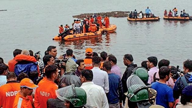 NDRF personnel rescue survivors from the swollen Godavari river in East Godavari district of Andhra Pradesh on Sunday afternoon.(PTI PHOTO.)