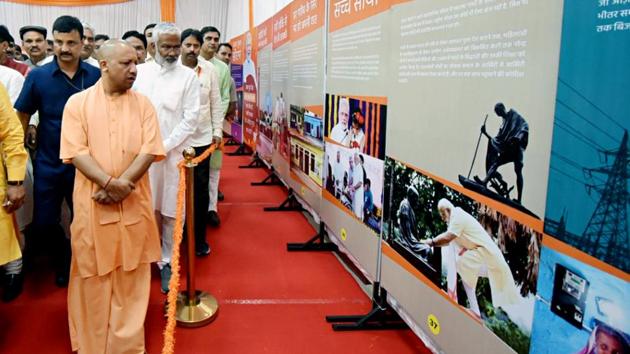 Uttar Pradesh Chief Minister Yogi Adityanath in the exhibition showcasing the work done by Prime Minister Narendra Modi, at BJP Headquarters in Lucknow .(ANI Photo) Uttar Pradesh Chief Minister Yogi Adityanath in the exhibition showcasing the work done by Prime Minister Narendra Modi, at BJP Headquarters in Lucknow .(ANI Photo)